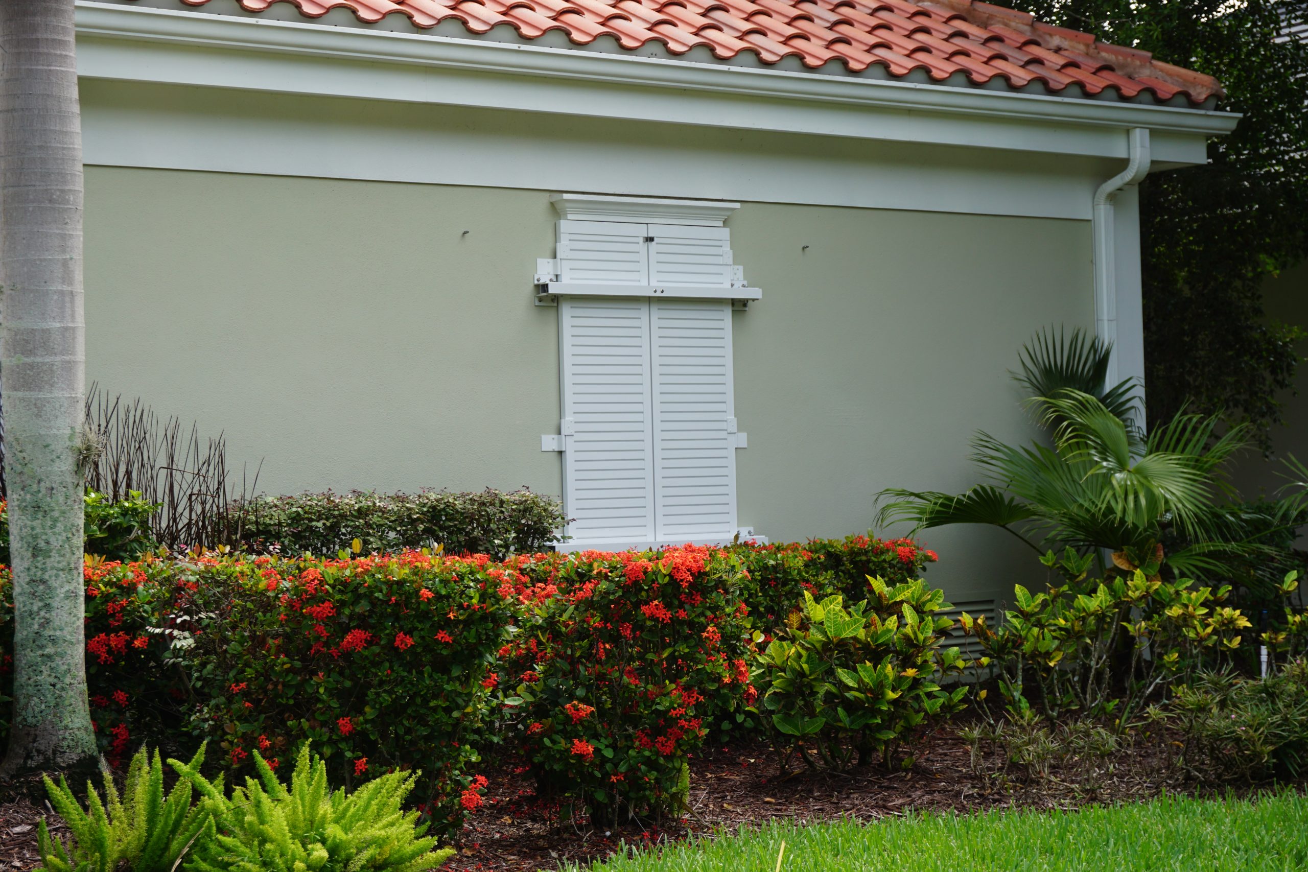 Colonial Impact Shutters (closed position) installed at The Landings in Sarasota
